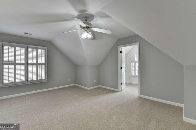 additional living space with visible vents, baseboards, carpet, and a ceiling fan