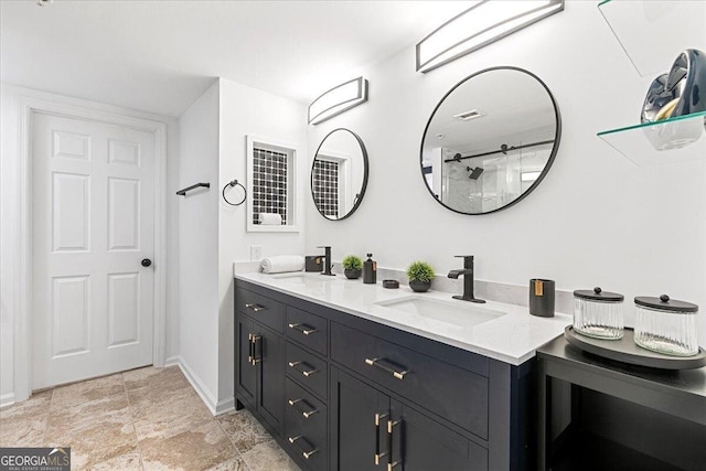 bathroom featuring double vanity, baseboards, visible vents, and a sink