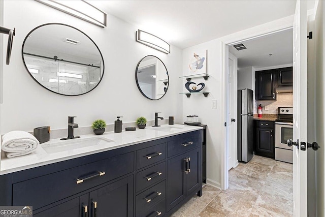 bathroom with a sink, visible vents, backsplash, and double vanity