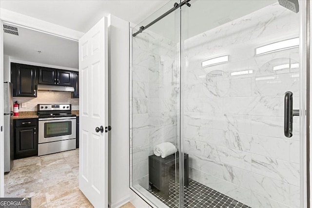 full bathroom with visible vents, backsplash, and a shower stall