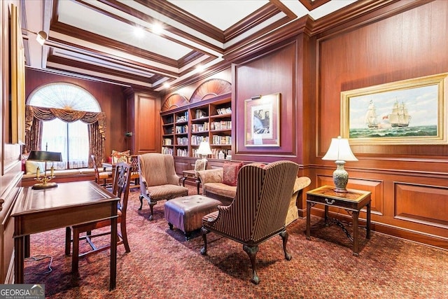 sitting room featuring built in shelves, carpet floors, coffered ceiling, beam ceiling, and ornamental molding