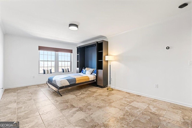 unfurnished bedroom featuring baseboards and ornamental molding