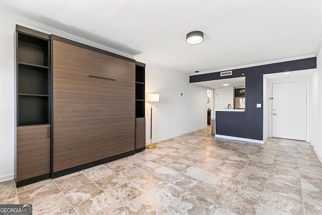 unfurnished living room with visible vents, baseboards, and ornamental molding