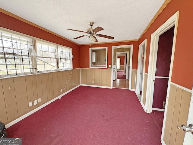 unfurnished sunroom featuring a ceiling fan