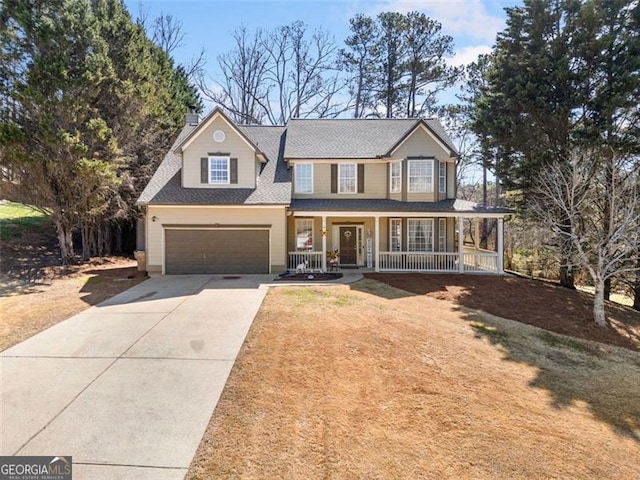 view of front of home featuring an attached garage, driveway, covered porch, and a chimney