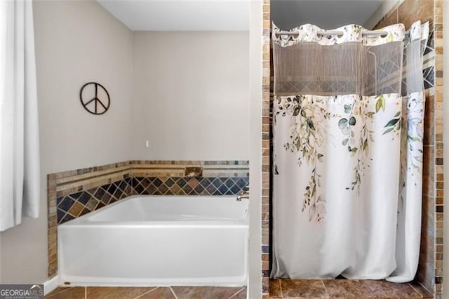 bathroom with a bath, a shower with curtain, and tile patterned floors