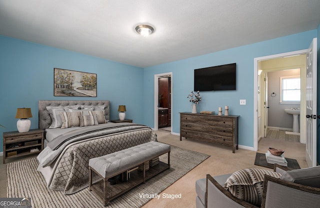 bedroom featuring baseboards and light carpet