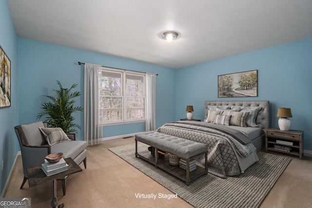 carpeted bedroom with baseboards