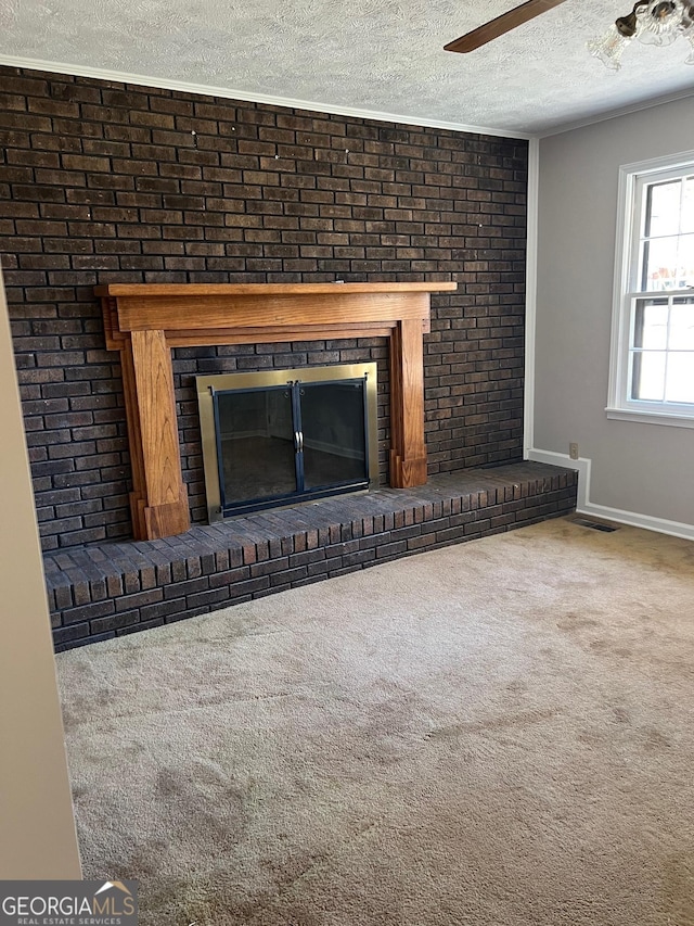 details featuring visible vents, a textured ceiling, carpet floors, a brick fireplace, and ceiling fan