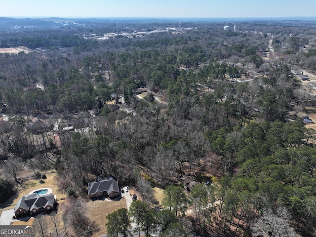 bird's eye view with a forest view