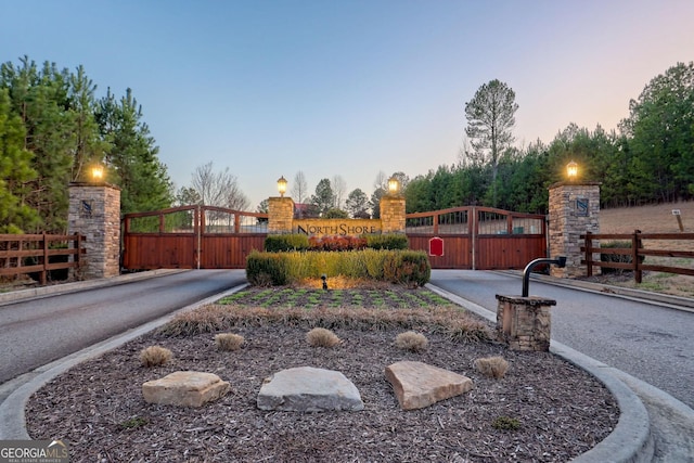 exterior space with fence and a gate