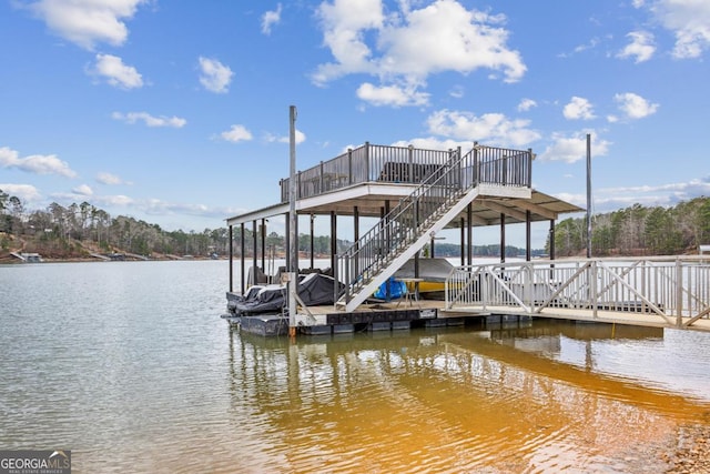 dock area featuring a water view, boat lift, and stairs