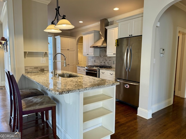 kitchen featuring a sink, open shelves, wall chimney exhaust hood, and stainless steel appliances