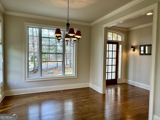 unfurnished dining area with baseboards, dark wood-style floors, a notable chandelier, and ornamental molding