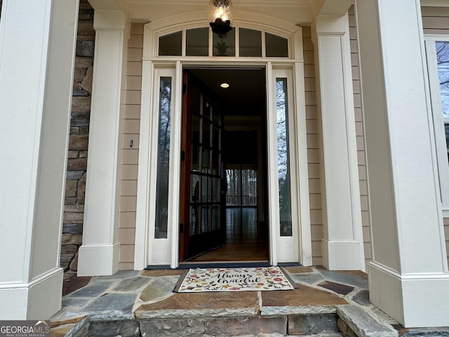 view of exterior entry featuring a porch