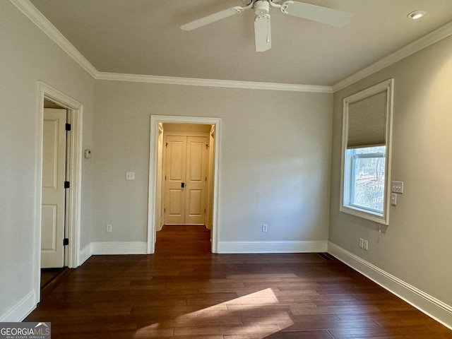 unfurnished room featuring crown molding, wood finished floors, and ceiling fan