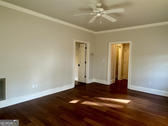 empty room featuring baseboards, ornamental molding, wood finished floors, and a ceiling fan