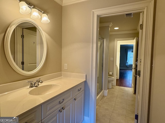 full bathroom featuring vanity, toilet, ornamental molding, tile patterned floors, and visible vents