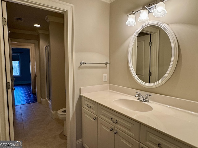 full bath with visible vents, a shower stall, toilet, tile patterned floors, and vanity