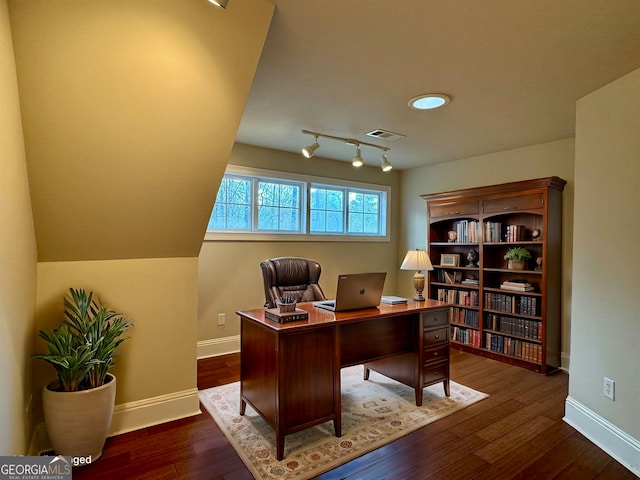 office space with dark wood finished floors, baseboards, and visible vents