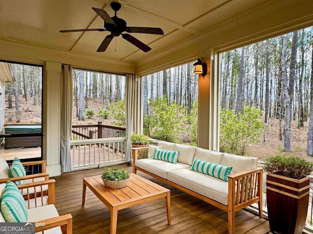 sunroom featuring a jacuzzi and coffered ceiling
