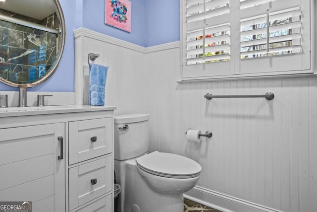 bathroom with vanity and toilet