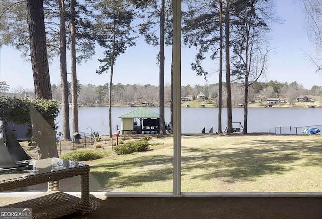 view of yard with a gazebo and a water view