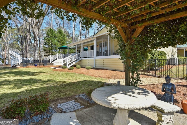 view of yard with stairs and fence