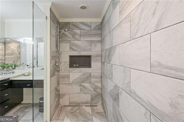 bathroom with a stall shower, ornamental molding, and vanity