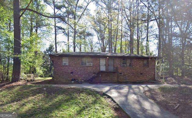 view of front of home with crawl space and french doors