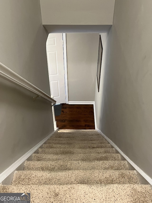 stairs featuring baseboards