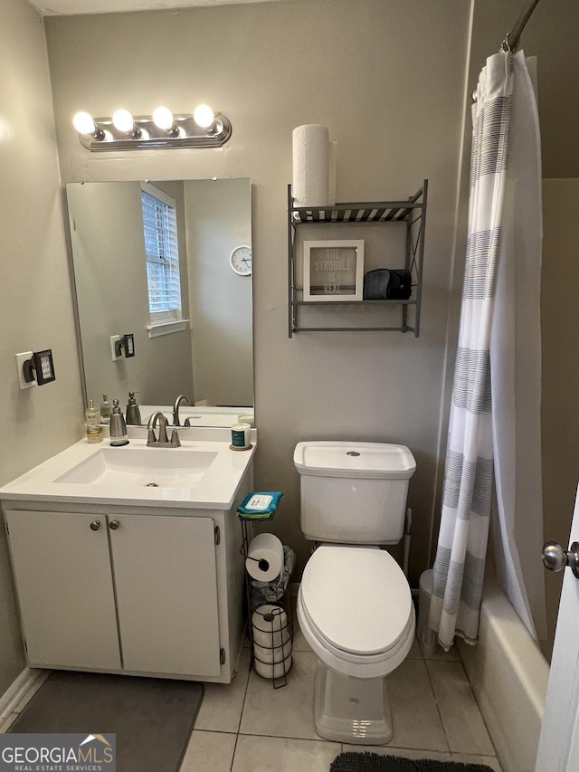 bathroom with tile patterned flooring, shower / bath combination with curtain, toilet, and vanity