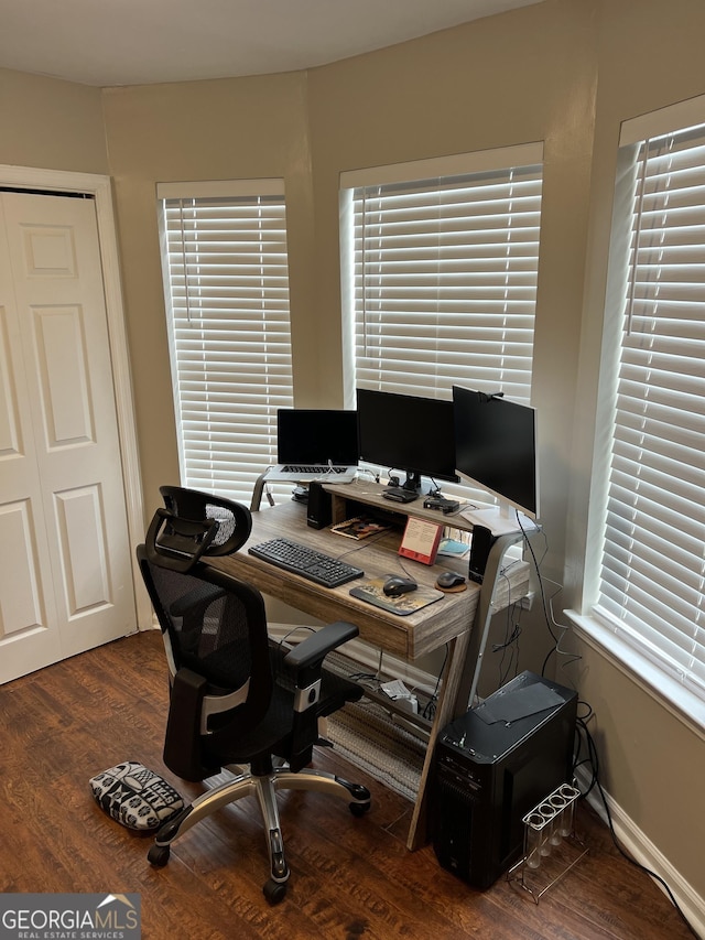 office area featuring plenty of natural light, baseboards, and wood finished floors