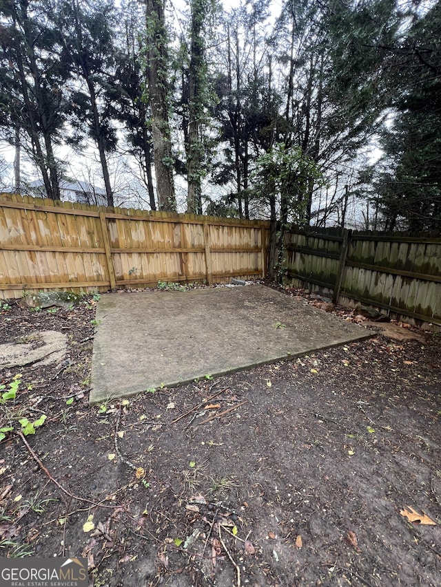 view of yard with a patio and fence