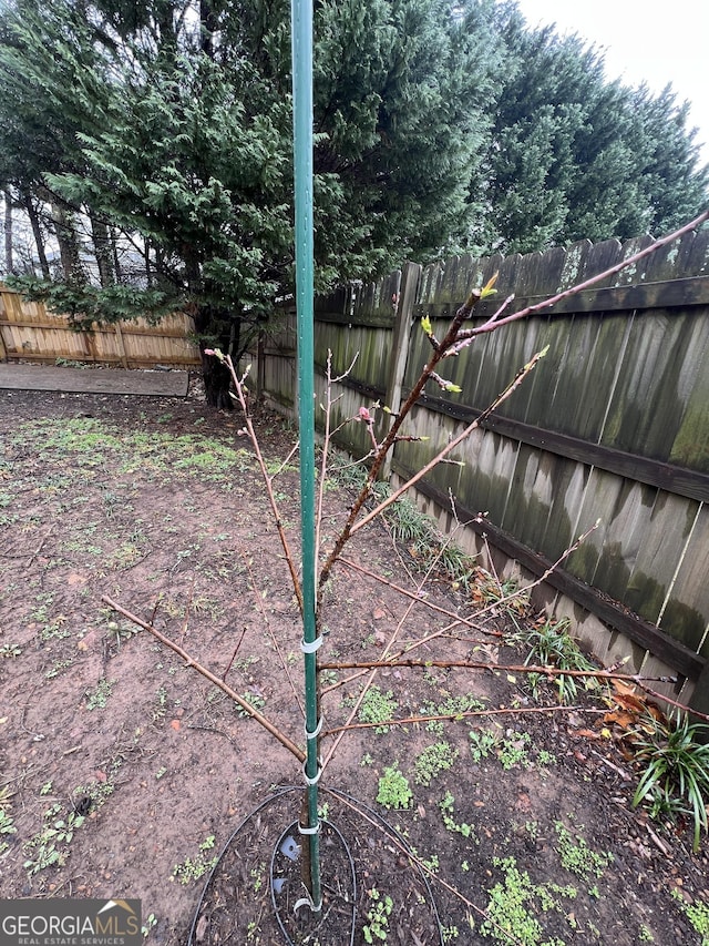 exterior details featuring a fenced backyard