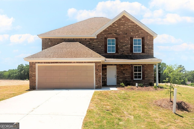 412 Clayton Scott St, Warner Robins, GA 31088 - view of front of house featuring a front yard, a shingled roof, concrete driveway, and brick siding