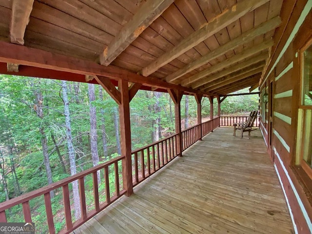 deck featuring a wooded view