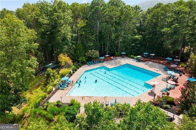 community pool with a patio area