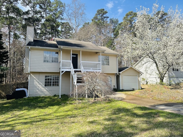 view of front of home with stairway, a porch, a chimney, and a front lawn