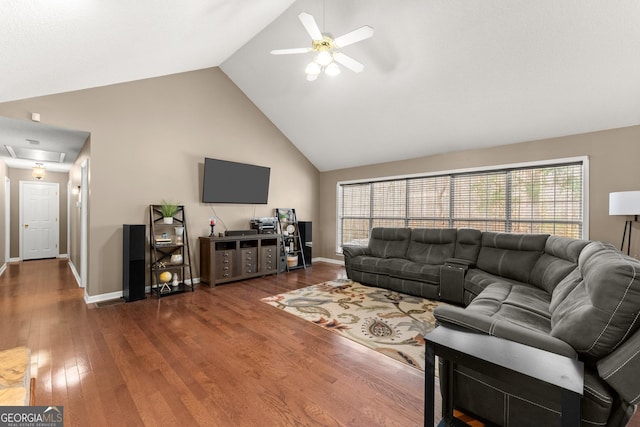 living room featuring wood finished floors, a ceiling fan, baseboards, and high vaulted ceiling