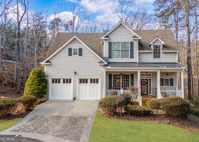 300 Rock Creek Trl, Toccoa, GA 30577 - traditional-style home featuring covered porch, a ceiling fan, driveway, a shingled roof, and a standing seam roof