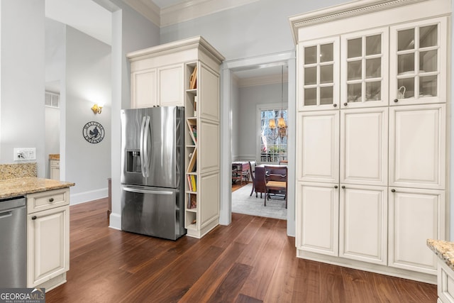 kitchen with visible vents, stainless steel appliances, crown molding, light stone countertops, and dark wood-style flooring