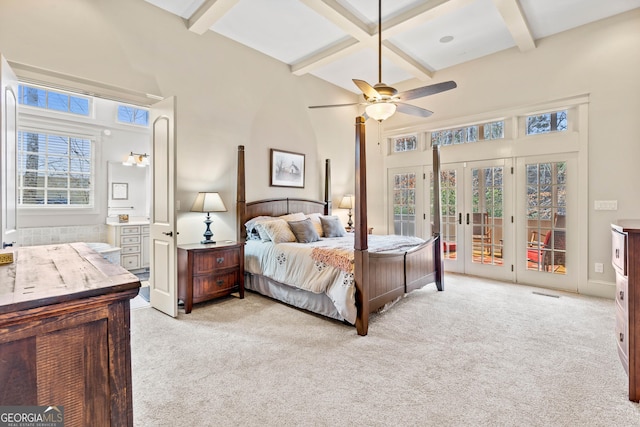 bedroom featuring french doors, beam ceiling, coffered ceiling, and access to exterior