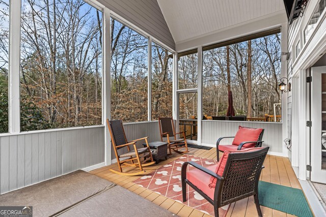 sunroom / solarium with lofted ceiling