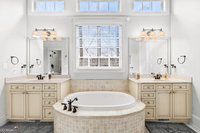 300 Rock Creek Trl, Toccoa, GA 30577 - bathroom with two vanities, healthy amount of natural light, and a garden tub