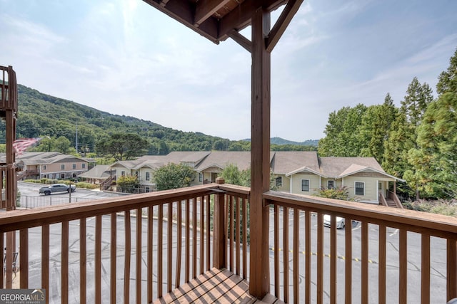 wooden terrace featuring a residential view