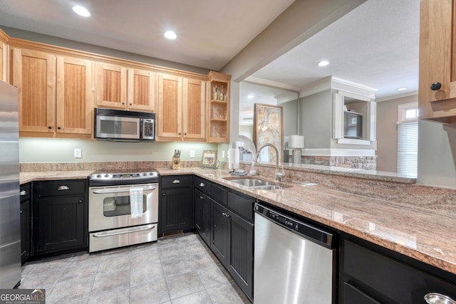 kitchen with crown molding, light stone counters, recessed lighting, stainless steel appliances, and a sink