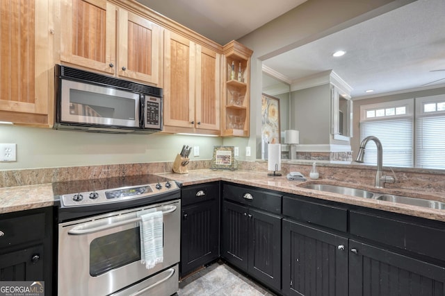 kitchen with light stone countertops, light brown cabinetry, ornamental molding, appliances with stainless steel finishes, and a sink