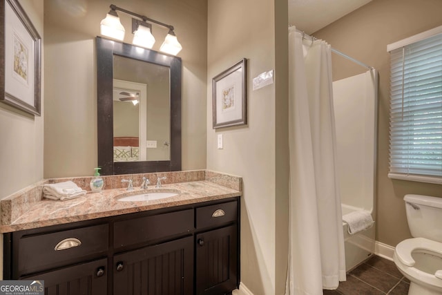 bathroom featuring tile patterned floors, toilet, curtained shower, baseboards, and vanity