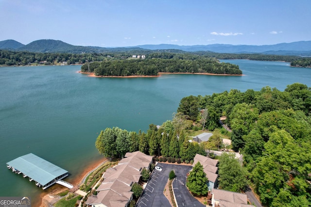 aerial view featuring a water and mountain view